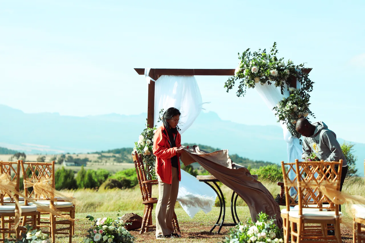 Planners setting up an outdoor wedding ceremony